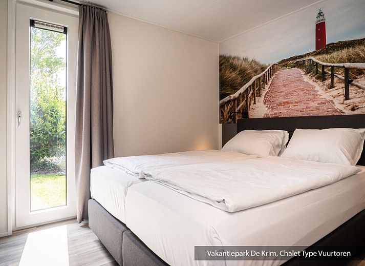 Chalet Typ Vuurtoren de Luxe in De Cocksdorp, Texel mit sonniger Terrasse und gruener Umgebung.