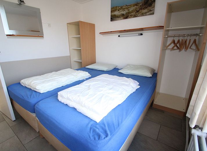 Gemuetliches Wohnzimmer im Bungalow Tamarisk 196, Texel, mit bequemer Sitzecke.