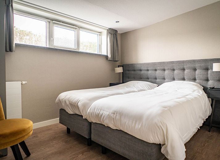 Cozy terrace at Type C Apartment de Stoeterij, De Cocksdorp, Texel, ideal for outdoor dining amid greenery.