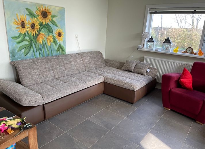 Enjoy the sunny veranda of Family House Dacha in De Cocksdorp, Texel, ideal for a relaxing vacation on the Wadden Islands.