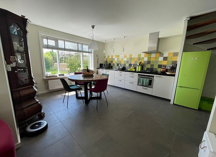 Enjoy the sunny veranda of Family House Dacha in De Cocksdorp, Texel, ideal for a relaxing vacation on the Wadden Islands.