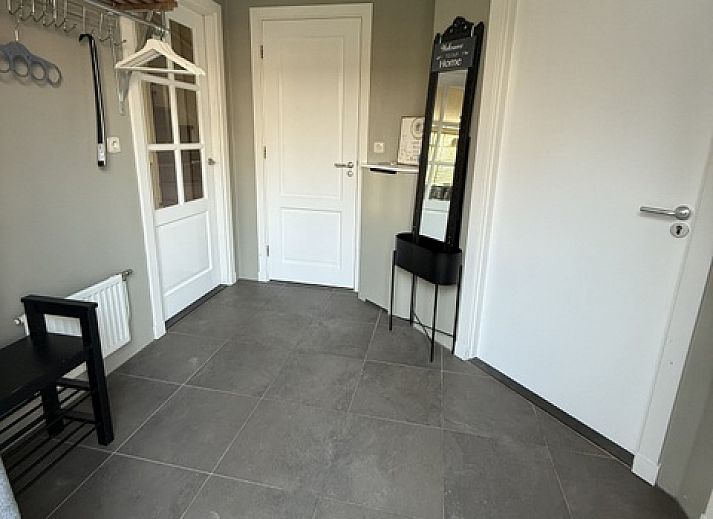 Enjoy the sunny veranda of Family House Dacha in De Cocksdorp, Texel, ideal for a relaxing vacation on the Wadden Islands.