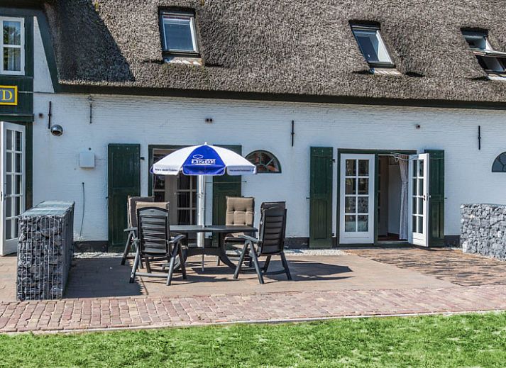 Gezellige woonkamer van Type S-2 vakantiehuis in De Cocksdorp, Texel met comfortabele zitruimte.