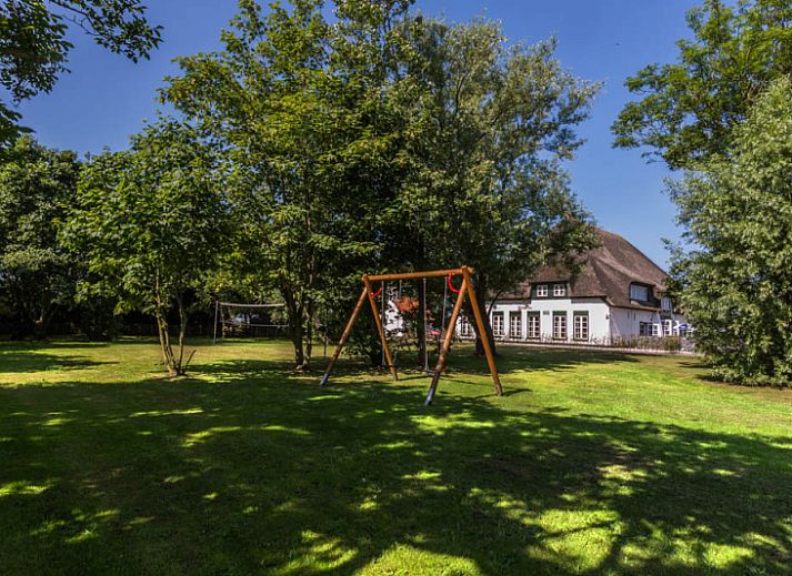 Gezellige woonkamer van Type S-2 vakantiehuis in De Cocksdorp, Texel met comfortabele zitruimte.
