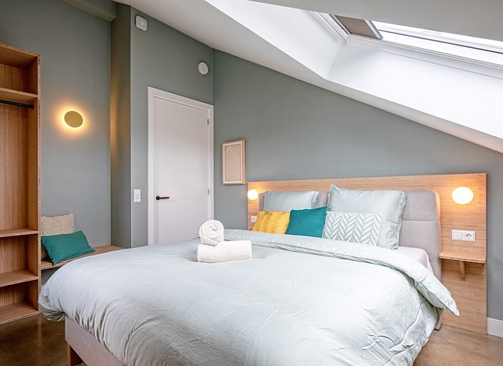 Gemuetliches Wohnzimmer im Ferienhaus Brakzand, De Cocksdorp Texel, mit Blick auf den Garten.