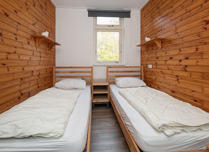 Bright living room of Bungalow Tamarisk 190, vacation home on Texel with comfortable interior.