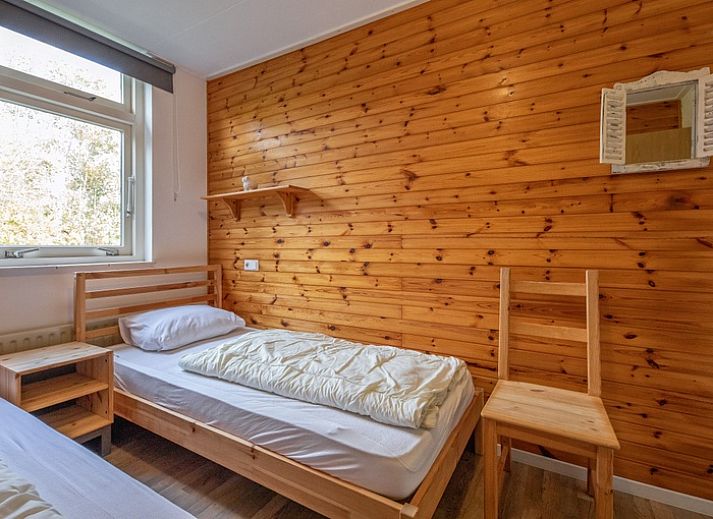 Bright living room of Bungalow Tamarisk 190, vacation home on Texel with comfortable interior.