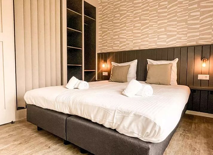 Entree van Huisje in De Cocksdorp, vakantiehuis in Texel, Waddeneilanden met rode bakstenen en landelijke charme.