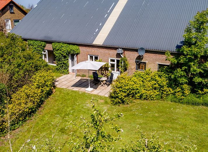 Aerial view of Cottage in De Cocksdorp, vacation home on Texel with vast fields and nature.