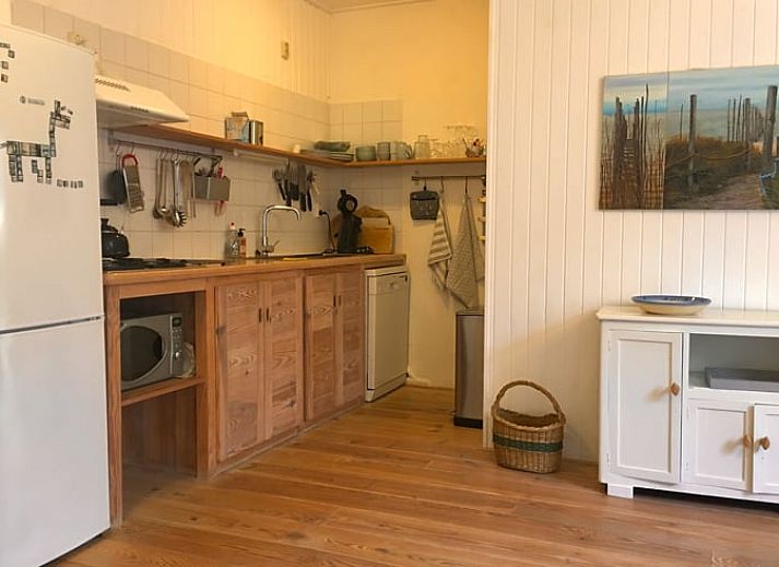 Cozy terrace at Cottage in De Cocksdorp, Texel, surrounded by greenery and tranquility.