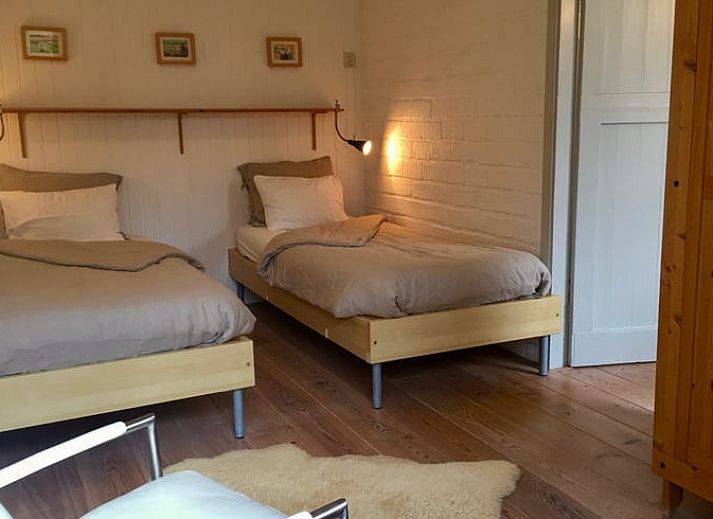 Cozy terrace at Cottage in De Cocksdorp, Texel, surrounded by greenery and tranquility.