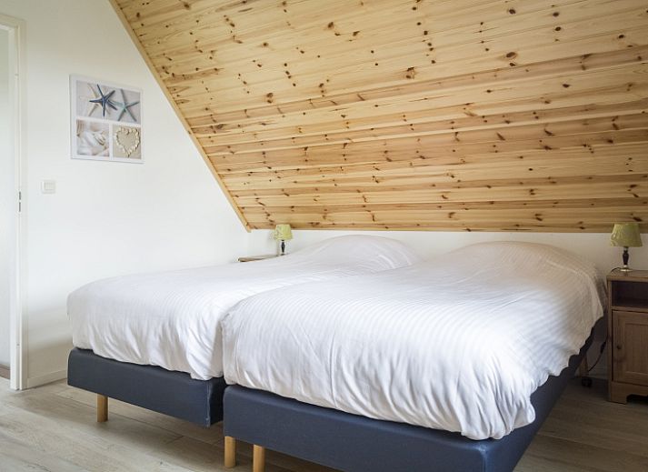 Ferienhaus Bungalow Klein Axel auf Texel mit einer schoenen Terrasse inmitten der Natur.