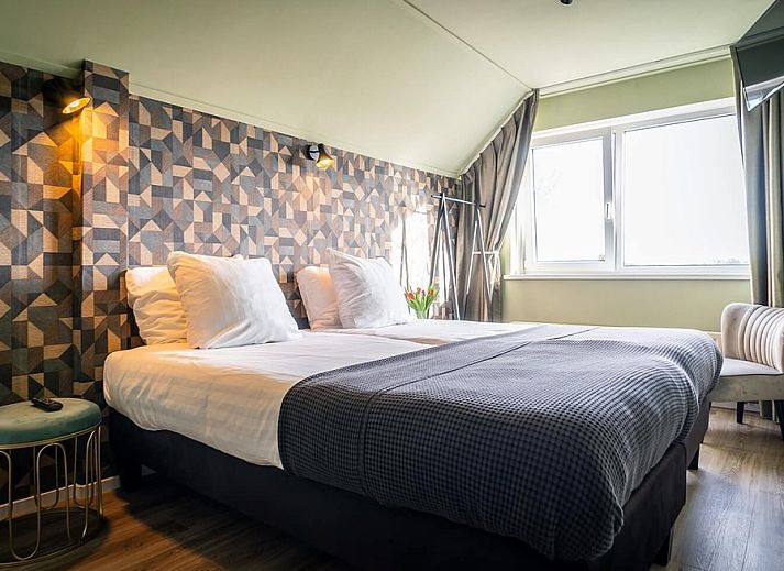Guest house 0101821 - Holiday property Texel - Tweepersoonskamer met uitzicht op de tuin