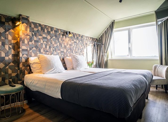 Guest house 0101821 - Holiday property Texel - Tweepersoonskamer met uitzicht op de tuin