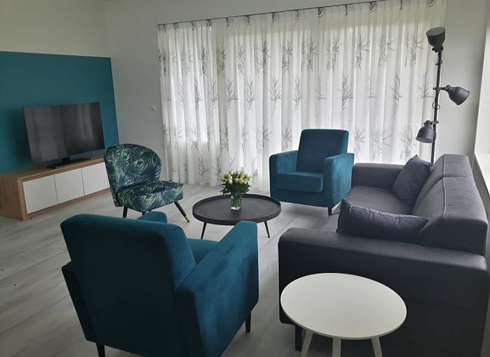 Bungalowpark Slufteroord - Duinzicht de Slufter in De Cocksdorp Texel, Ferienhaus mit sonniger Terrasse und gruenem Garten.