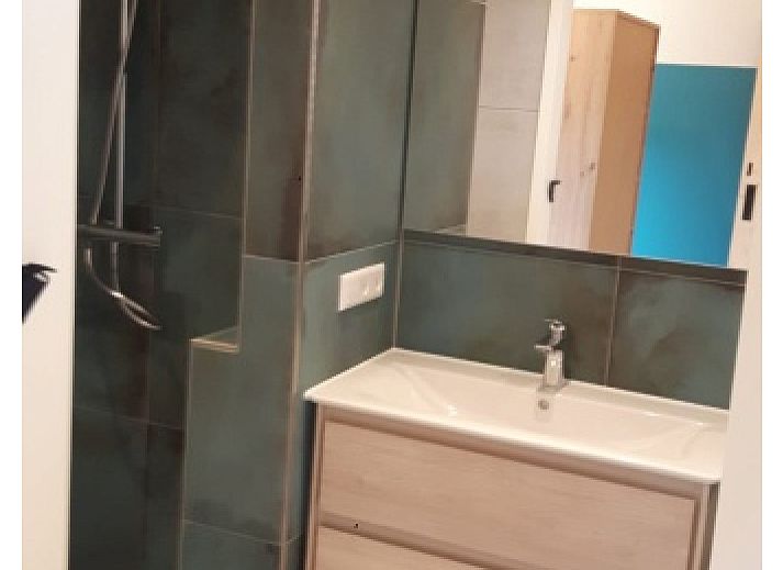 Stilvolles Wohnzimmer im Bungalowpark Slufteroord - Duinzicht de Slufter, De Cocksdorp Texel, mit moderner Einrichtung und grosszuegiger Aufteilung.