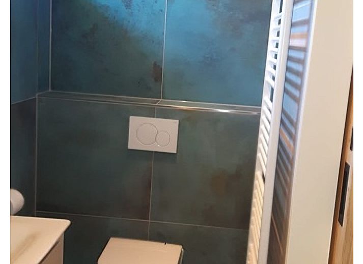 Stilvolles Wohnzimmer im Bungalowpark Slufteroord - Duinzicht de Slufter, De Cocksdorp Texel, mit moderner Einrichtung und grosszuegiger Aufteilung.