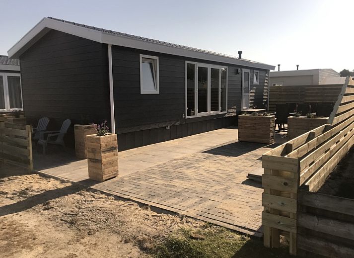 Chalet Bregkoog 231 in De Koog, Texel with spacious terrace and modern look at Chaletpark Bregkoog.