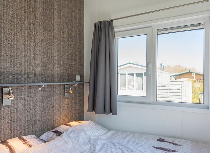 Cozy living room of Chalet Bregkoog 231, De Koog, Texel with comfortable seating area at Chaletpark Bregkoog.