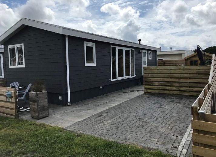 Dining area in Chalet Bregkoog 231, De Koog, Texel overlooking the terrace on Chaletpark Bregkoog.