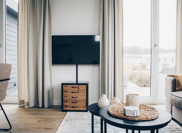 Front view of Chalet Bregkoog 119 on Chaletpark Bregkoog in De Koog, Texel, with sunny veranda.