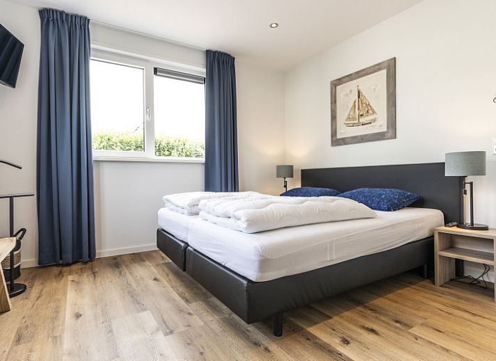 Villa 41 in De Koog, Texel, with sunny terrace and green garden, ideal vacation home on the Wadden Islands.