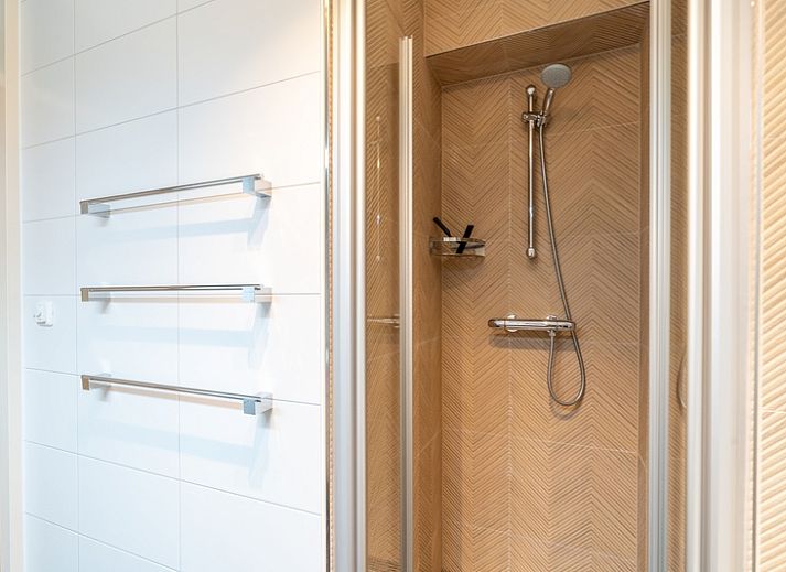 Spacious living room with comfortable sofa in Apartment Juliana 086, De Koog, Texel.