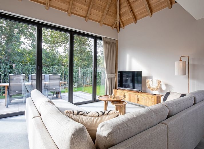 Stylish living room of Villa Flo, vacation home in De Koog, Texel with modern decor.