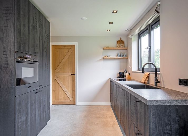 Stylish living room of Villa Flo, vacation home in De Koog, Texel with modern decor.