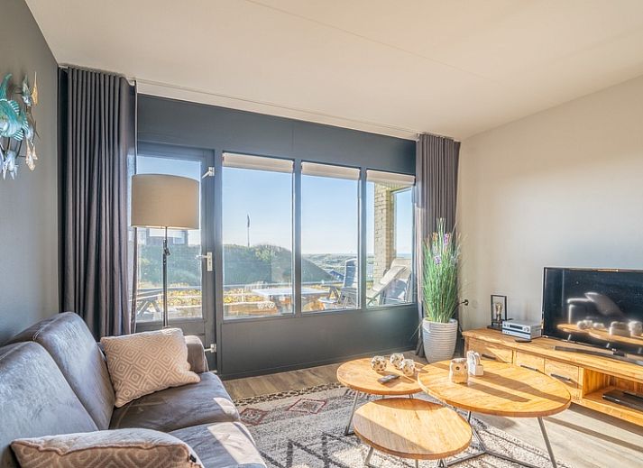 Gezellige woonkamer in Appartement Juliana 048 met uitzicht op zee, gelegen in De Koog, Texel, Waddeneilanden.