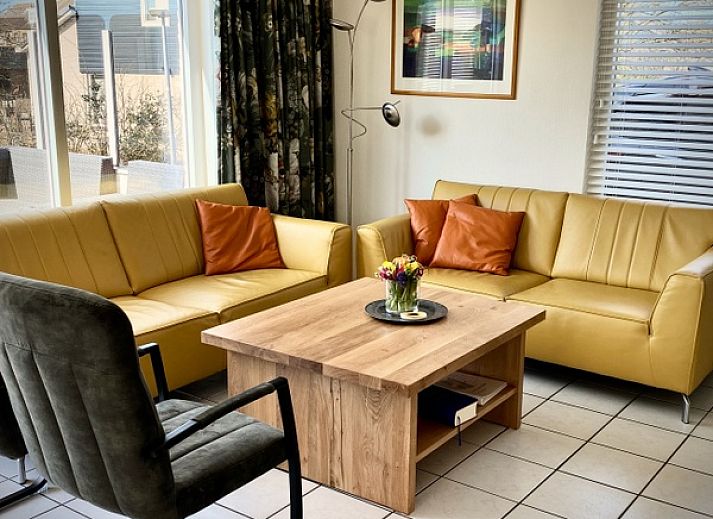 Sunny terrace with pool at Stappeland - Huize 100-1, vacation home in De Koog, Texel, ideal for relaxation.