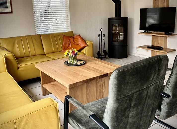 Sunny terrace with pool at Stappeland - Huize 100-1, vacation home in De Koog, Texel, ideal for relaxation.