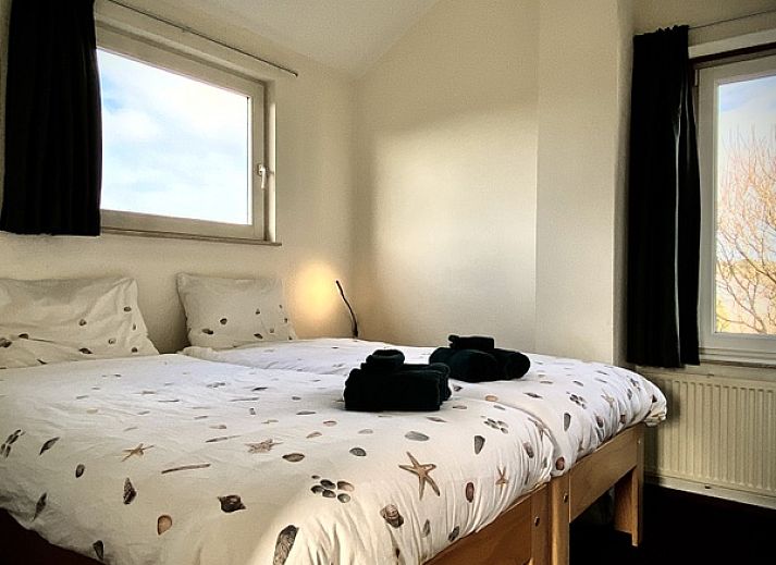 Sunny terrace with pool at Stappeland - Huize 100-1, vacation home in De Koog, Texel, ideal for relaxation.