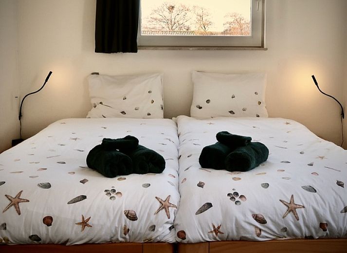 Sunny terrace with pool at Stappeland - Huize 100-1, vacation home in De Koog, Texel, ideal for relaxation.