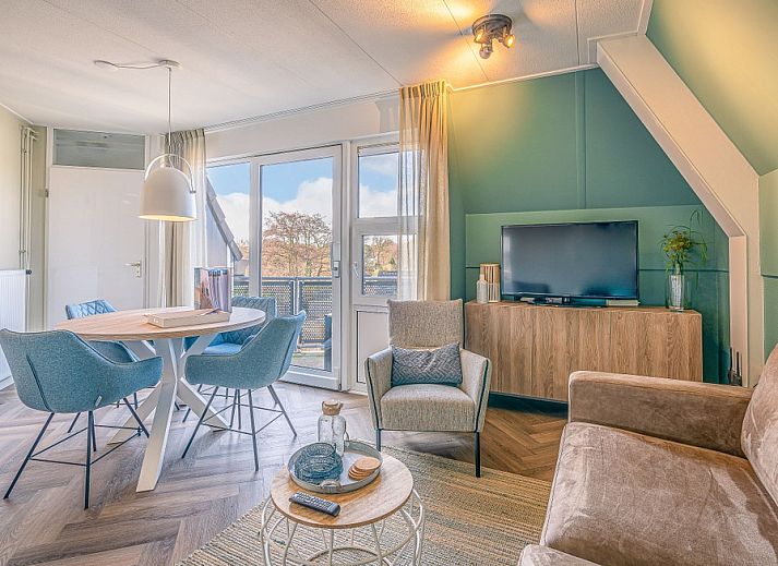 Cozy living room in Apartment Zeedistel 22, De Koog, Texel with modern interior and lots of light.