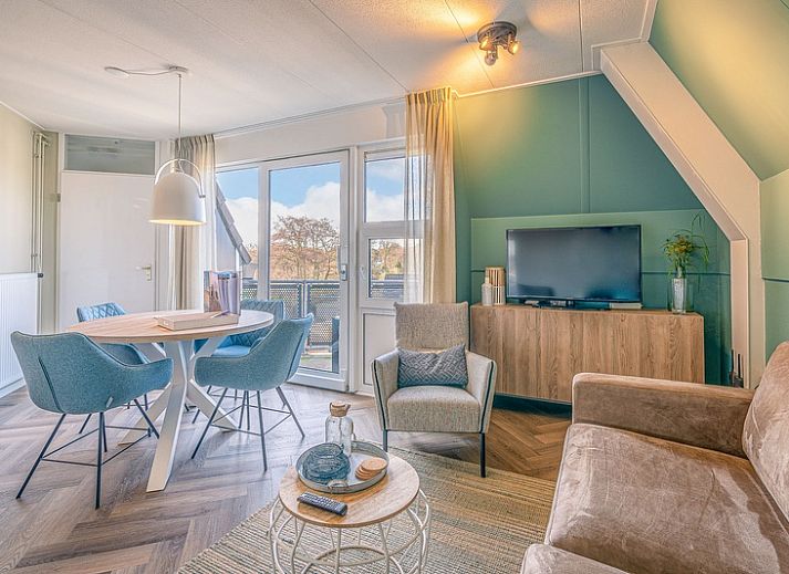 Cozy living room in Apartment Zeedistel 22, De Koog, Texel with modern interior and lots of light.