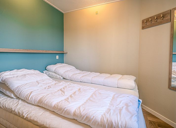 Stylish seating area in Apartment Zeedistel 22, De Koog, Texel with comfortable furniture and views of the surroundings.