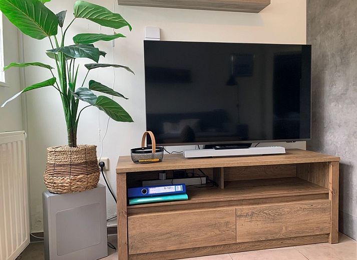 Modern kitchen and dining area in Duo bungalow, vacation home in De Koog, Texel on the Wadden Islands.