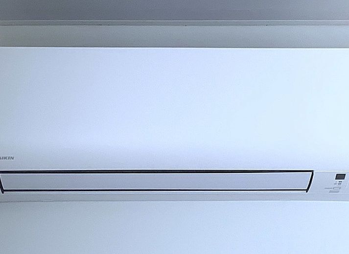 Modern kitchen and dining area in Duo bungalow, vacation home in De Koog, Texel on the Wadden Islands.