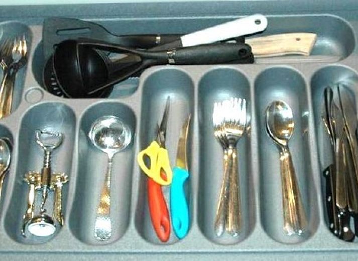 Stylish interior of Duo bungalow, vacation home in De Koog, Texel with open kitchen and sitting area.