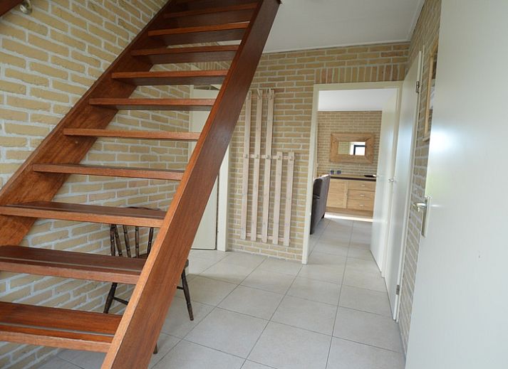 Attractive indoor area of Holiday Home Stappeland 213 in De Koog, Texel with fireplace and spacious seating.