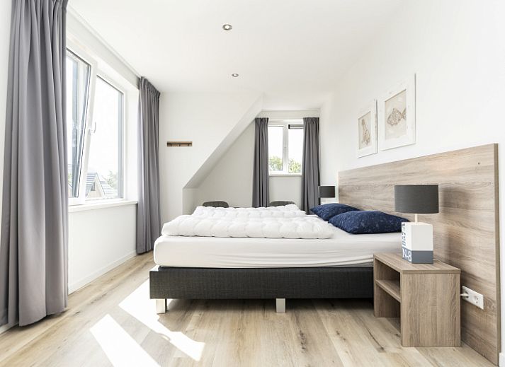 Bright living room of Villa 21A in De Koog, Texel, vacation home with stylish decor on the Wadden Islands.