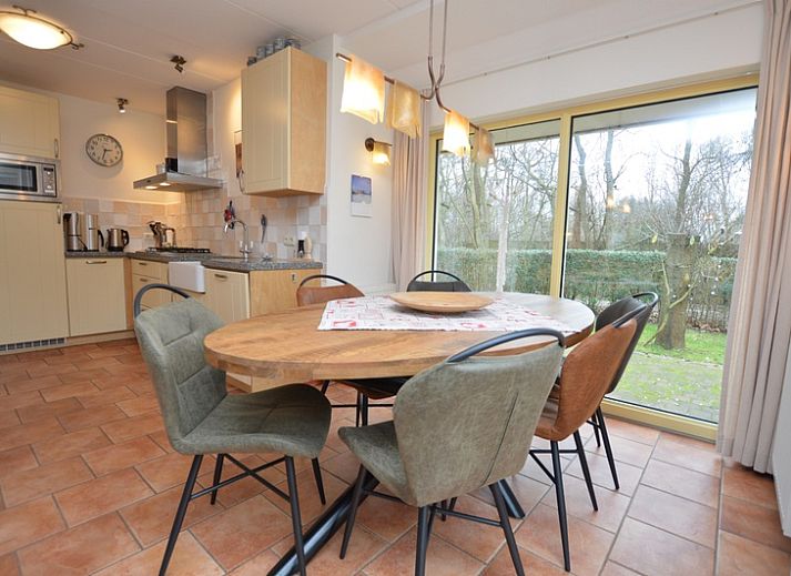 Cozy living room of Holiday Home 7K in De Koog, Texel with comfortable sofas and modern amenities.