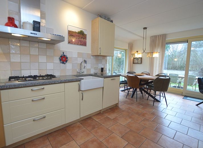 Cozy living room of Holiday Home 7K in De Koog, Texel with comfortable sofas and modern amenities.