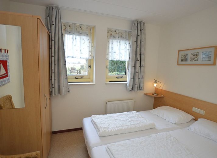 Cozy living room of Holiday Home 7K in De Koog, Texel with comfortable sofas and modern amenities.