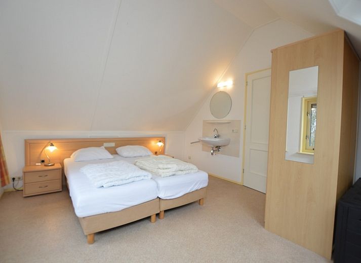 Bright living room in Holiday home 7K, De Koog, Texel with spacious seating area and television for relaxation on the Wadden Islands.