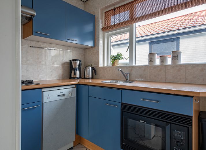 Cozy living room in vacation home Riddertje, De Koog, Texel. Comfortable seating area for relaxation.
