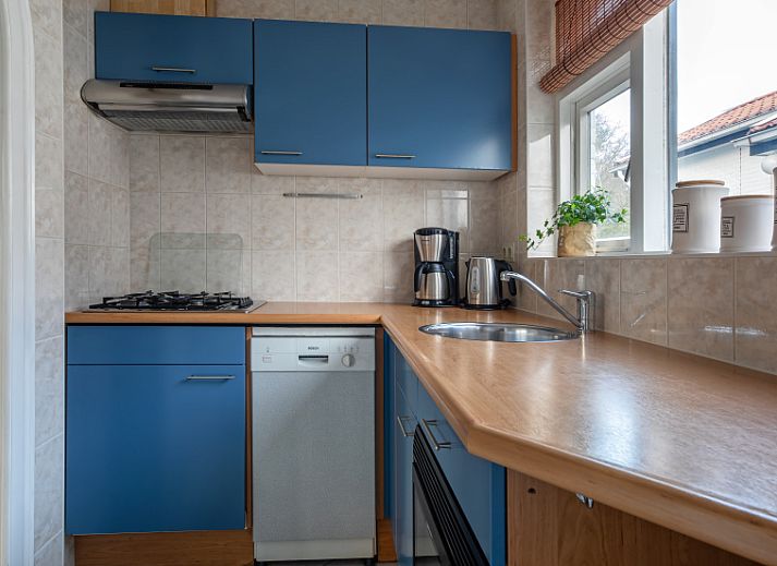 Cozy living room in vacation home Riddertje, De Koog, Texel. Comfortable seating area for relaxation.