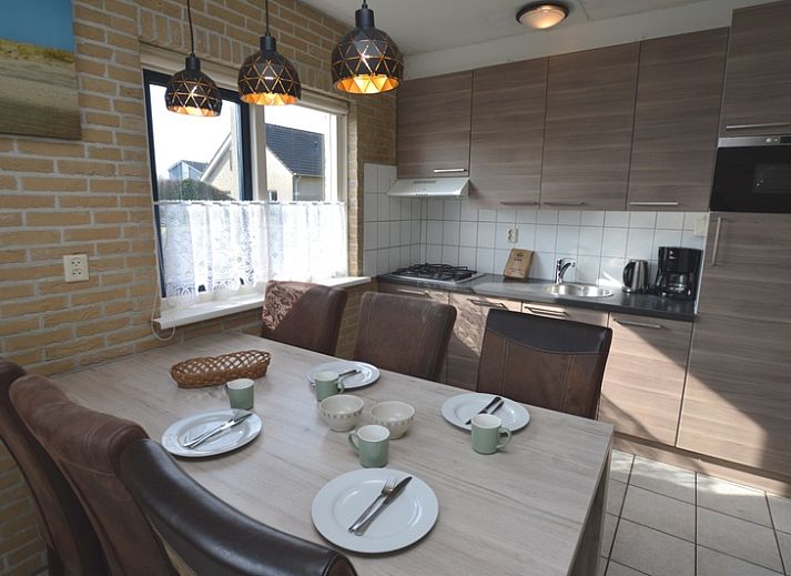 Cozy living room in Holiday home Stappeland 207, De Koog, Texel with comfortable sofas and lots of natural light.