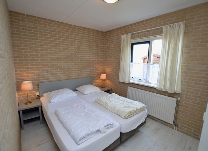 Cozy living room in Holiday home Stappeland 207, De Koog, Texel with comfortable sofas and lots of natural light.